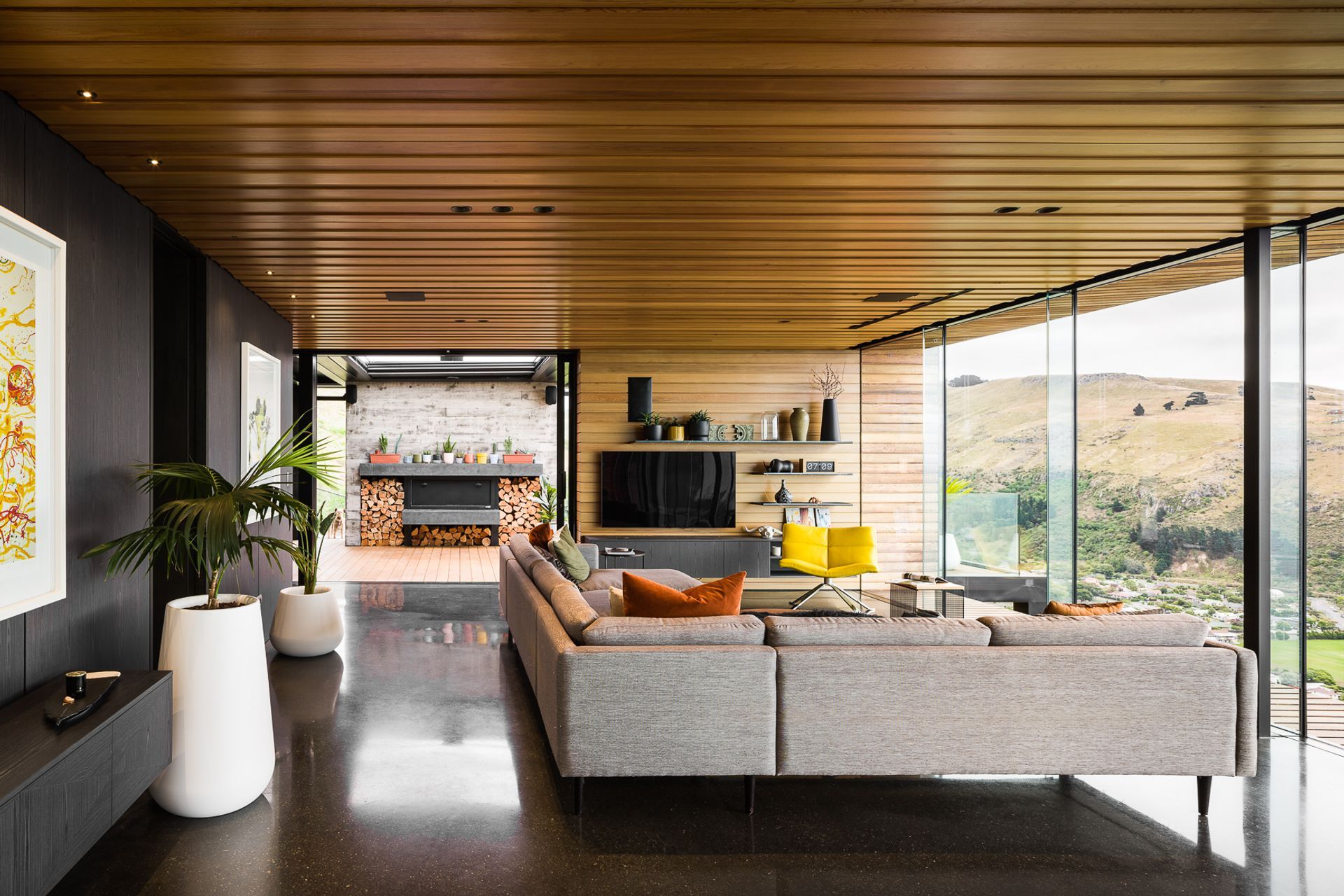 The outdoor fireplace mantel and hearth are coloured the same gloss black as the floors, but using 'natural' and acrylic sealers gives them an entirely different look.