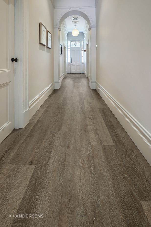 A traditional character hallway gets a slick new flooring update with vinyl longboard flooring.
