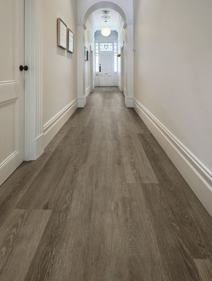 A traditional character hallway gets a slick new flooring update with vinyl longboard flooring.