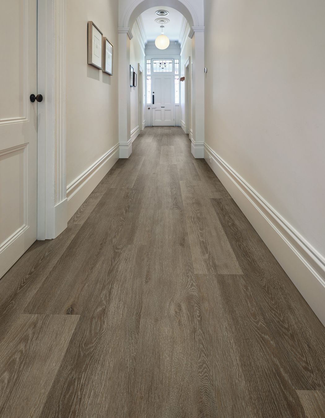 A traditional character hallway gets a slick new flooring update with vinyl longboard flooring.