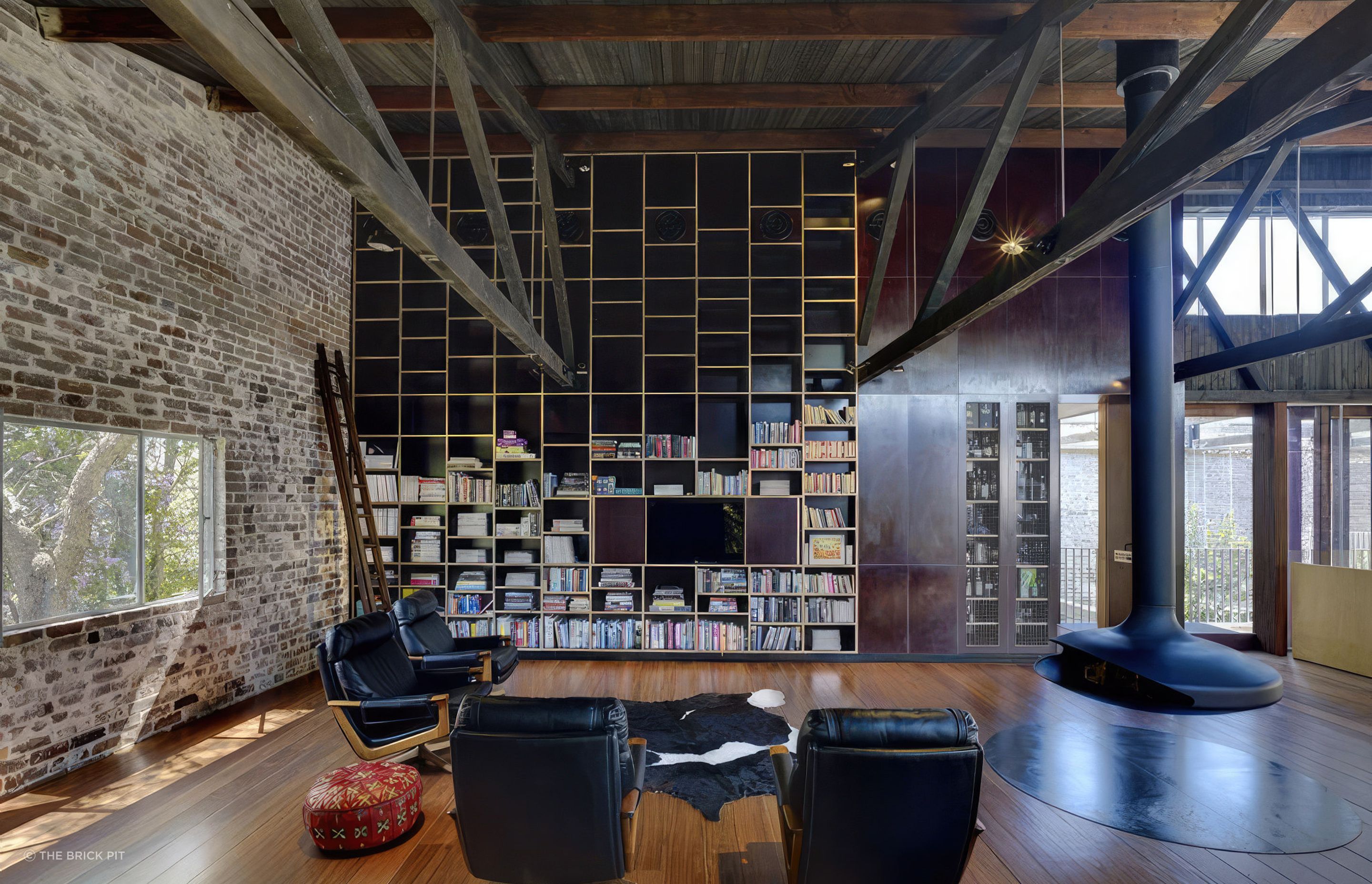 In this warehouse conversion, recycled bricks are a feature that grounds the home.