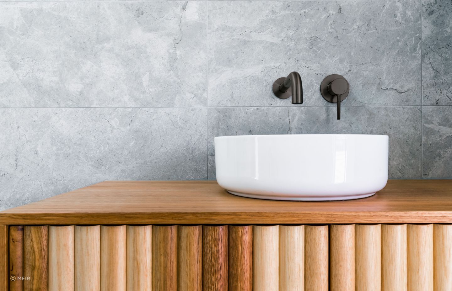 The stylish Round Curved Spout in a shadow finish