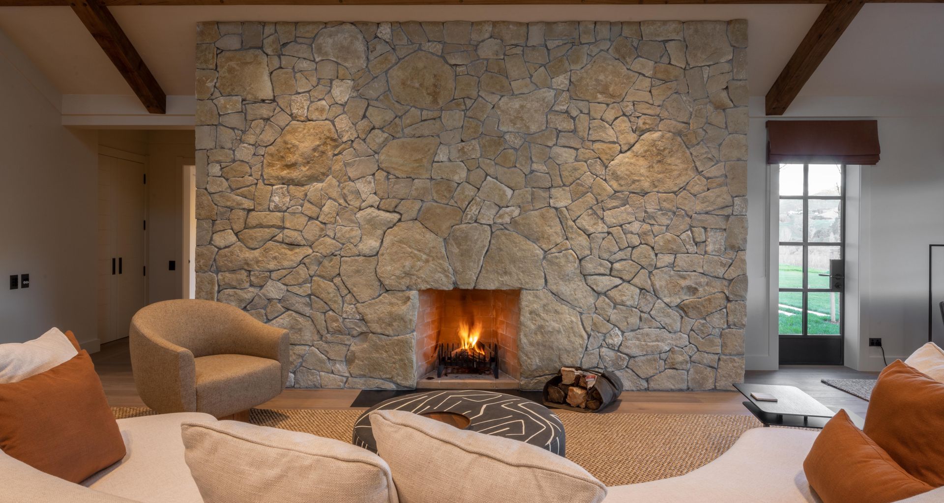 Over-sized pieces of limestone are blended in to create a show-stopper in this lodge fireplace.