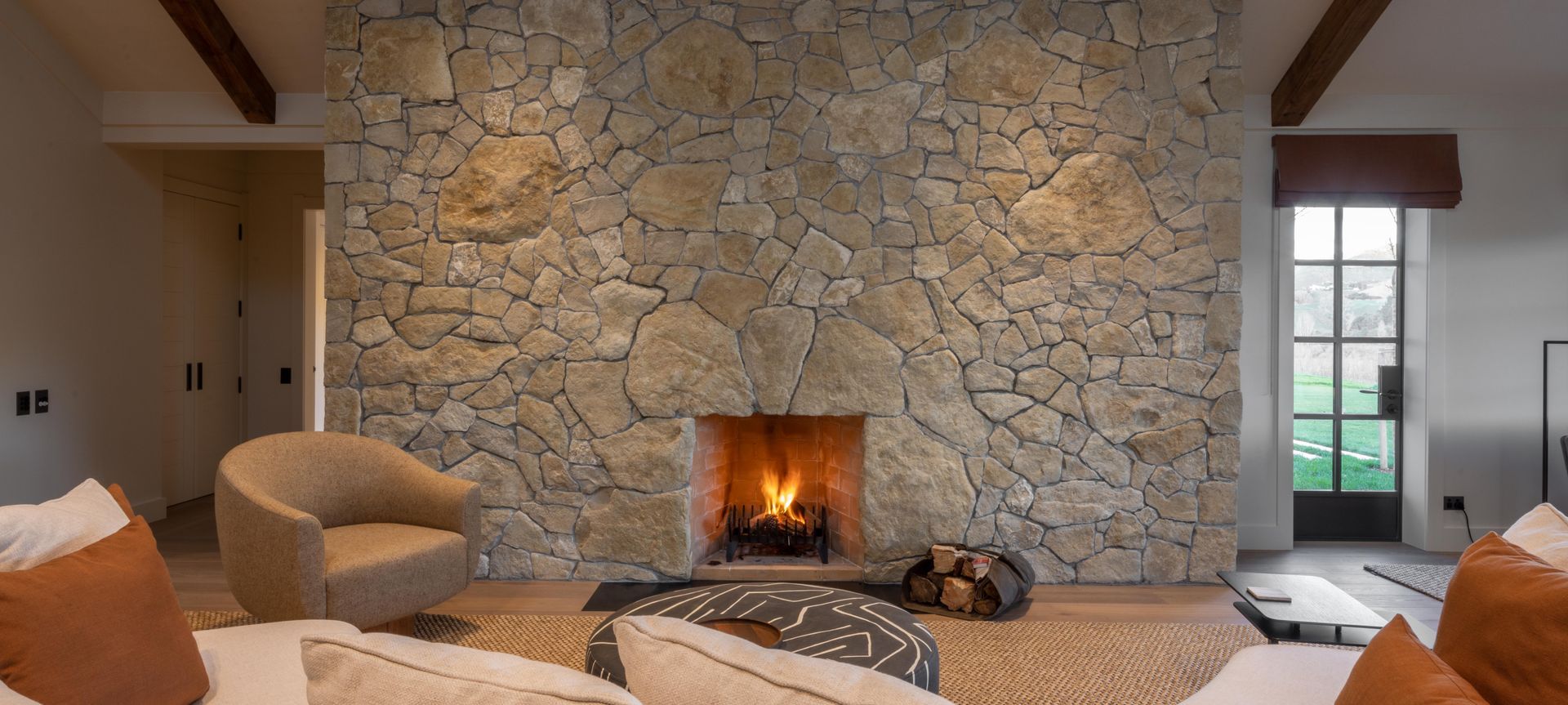 Over-sized pieces of limestone are blended in to create a show-stopper in this lodge fireplace.
