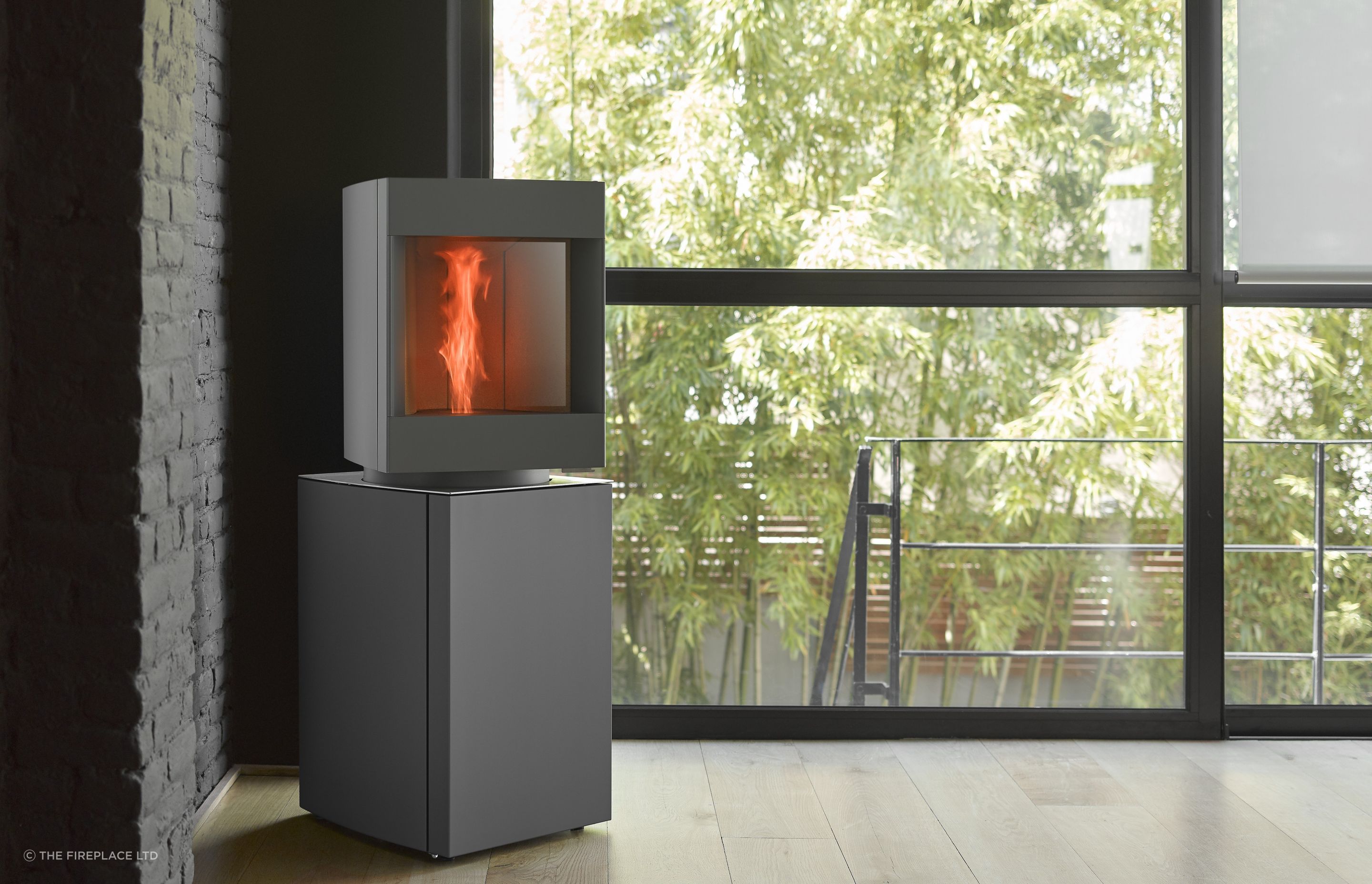 The award winning Stûv P-10 pellet freestanding fire comprises two distinct sections: at the top is a real fire, designed to show off the flames, while underneath there is a stock of wood pellets and the technical components.