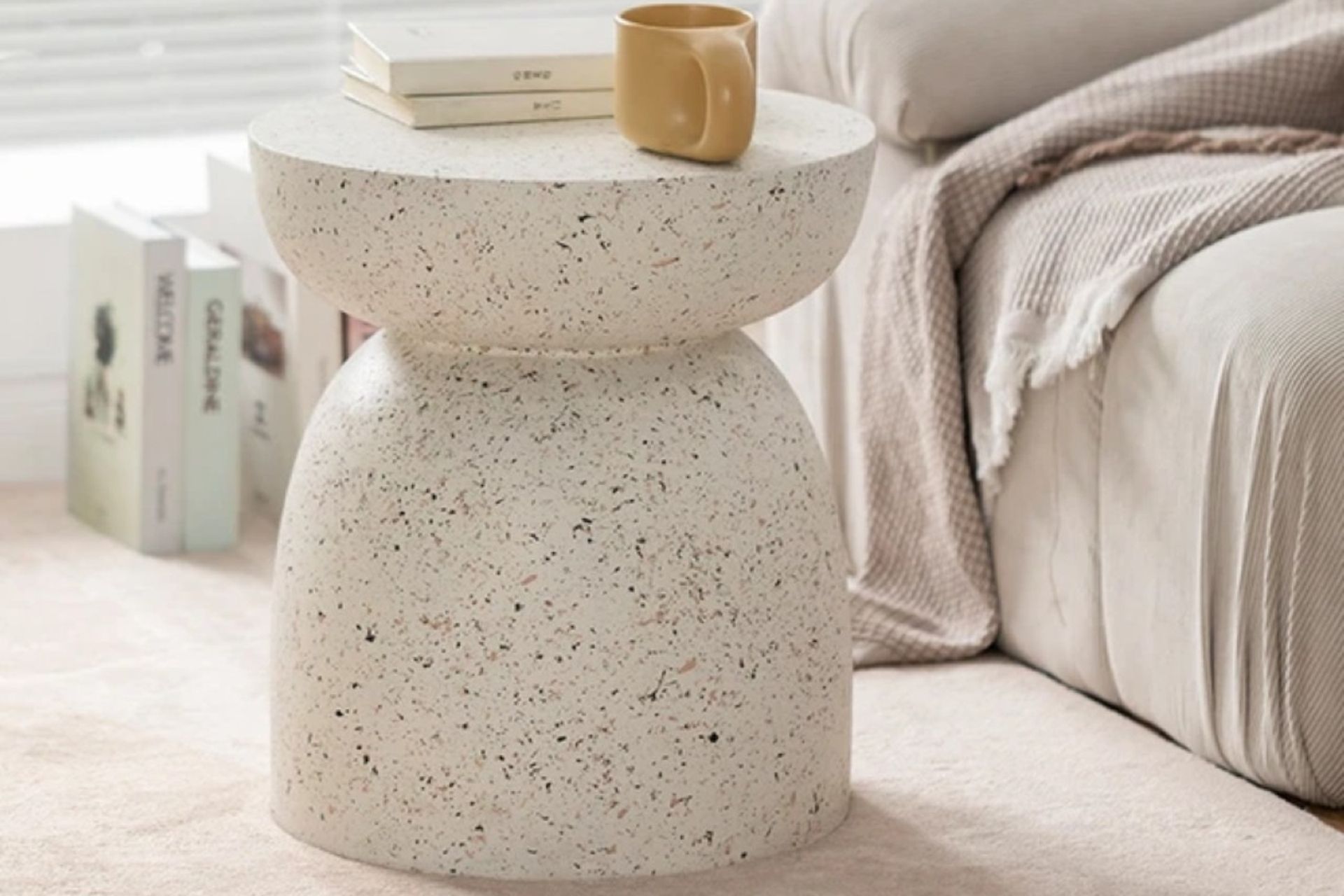 Made from a durable fibre-cement blend, the Pedestal Side Table from Home Lab can be used inside or out.