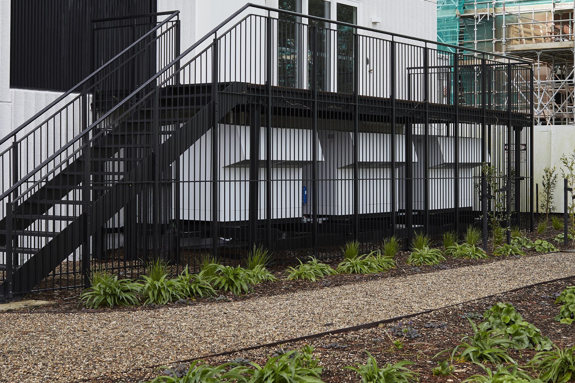 The hot water system units are discreetly located under an external deck.