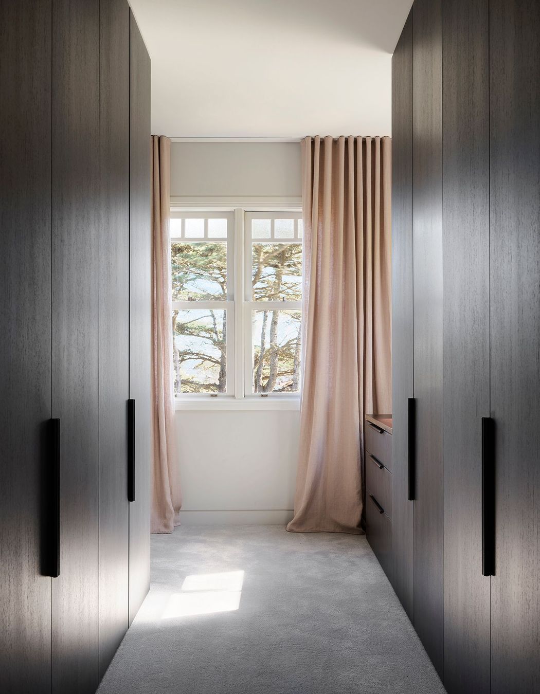 Edge Pull handles provide symmetry in the dressing room.