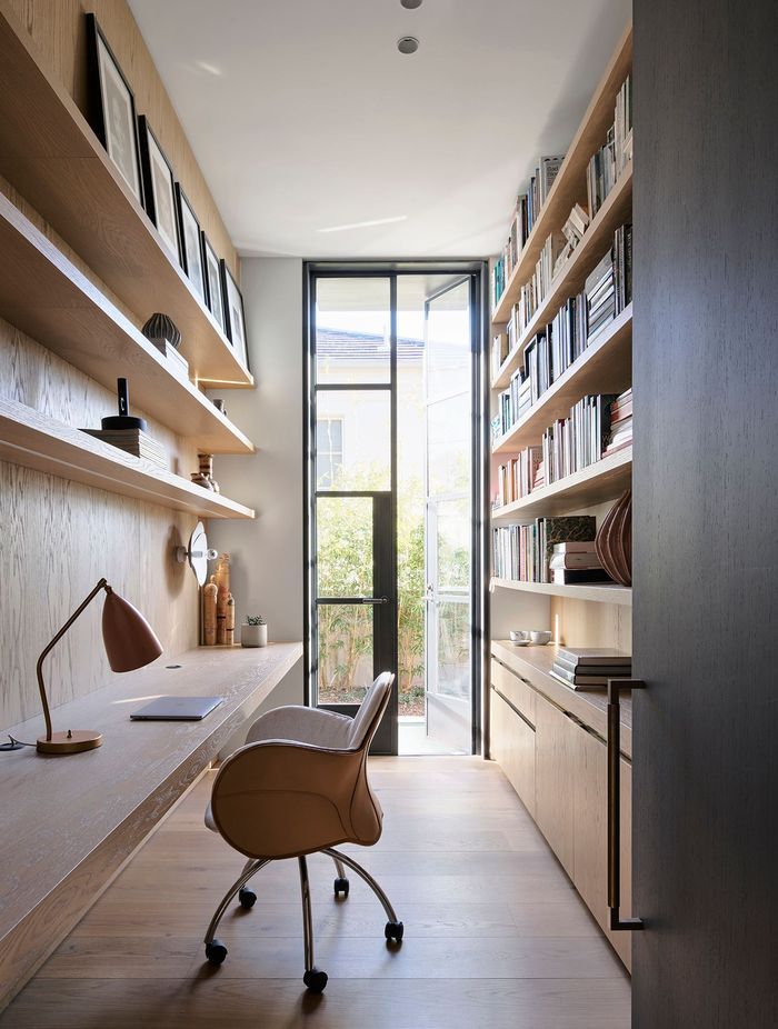 The entrance to the private office features the Mid Antique Brass Waxed finish.