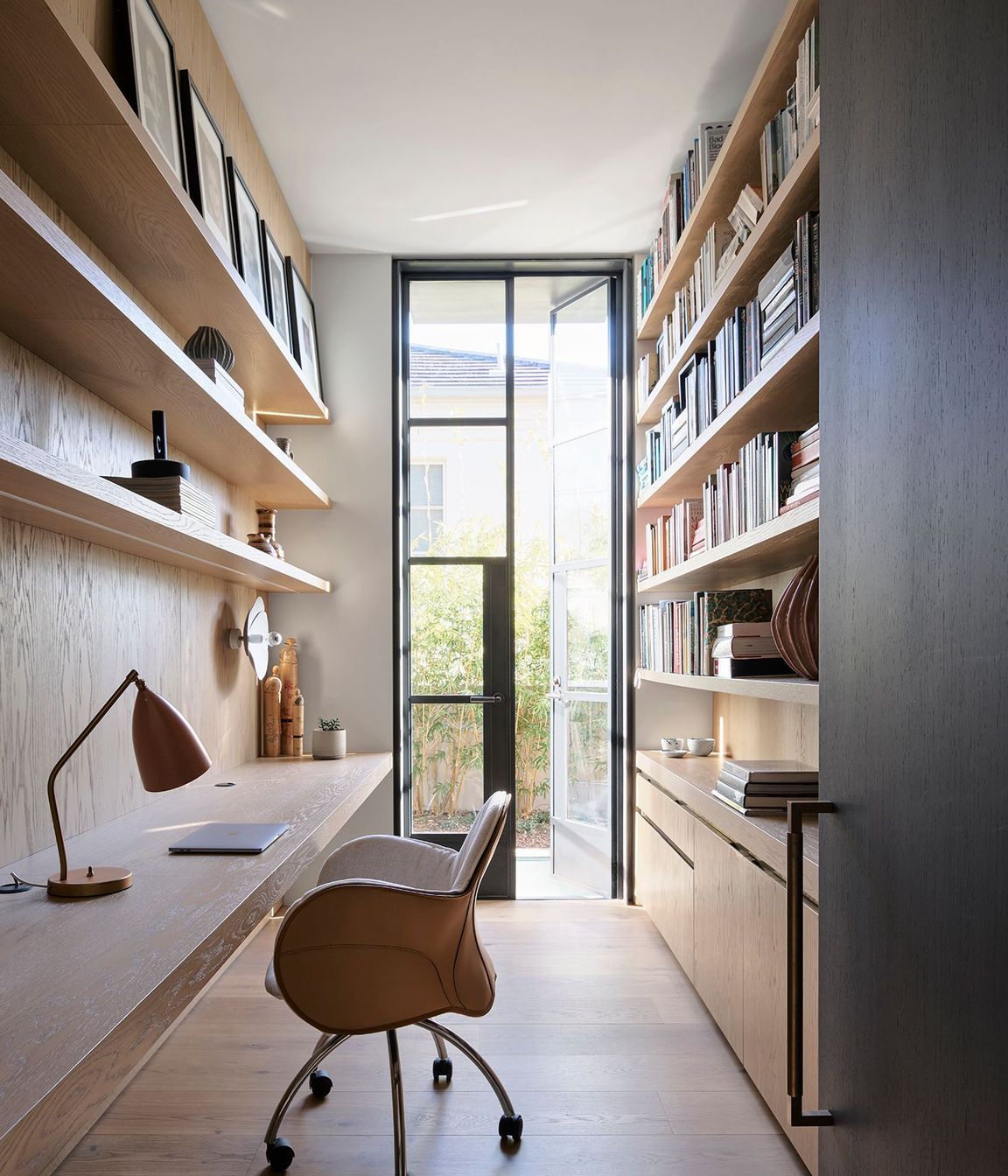 The entrance to the private office features the Mid Antique Brass Waxed finish.