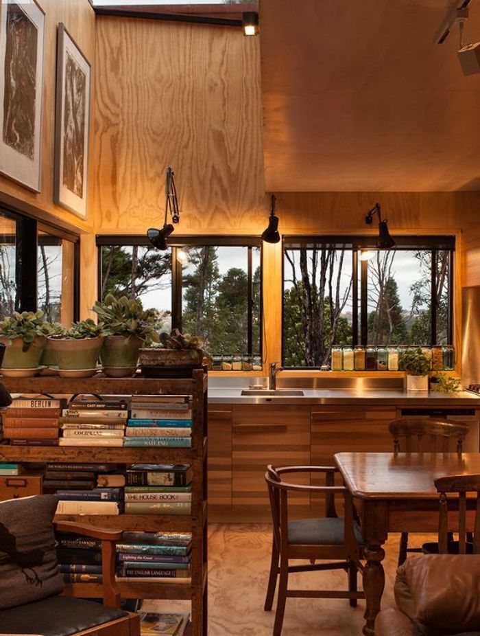 'Red House' by Crosson Architects is surrounded by native New Zealand bush, creating a utopic, cosy ambience