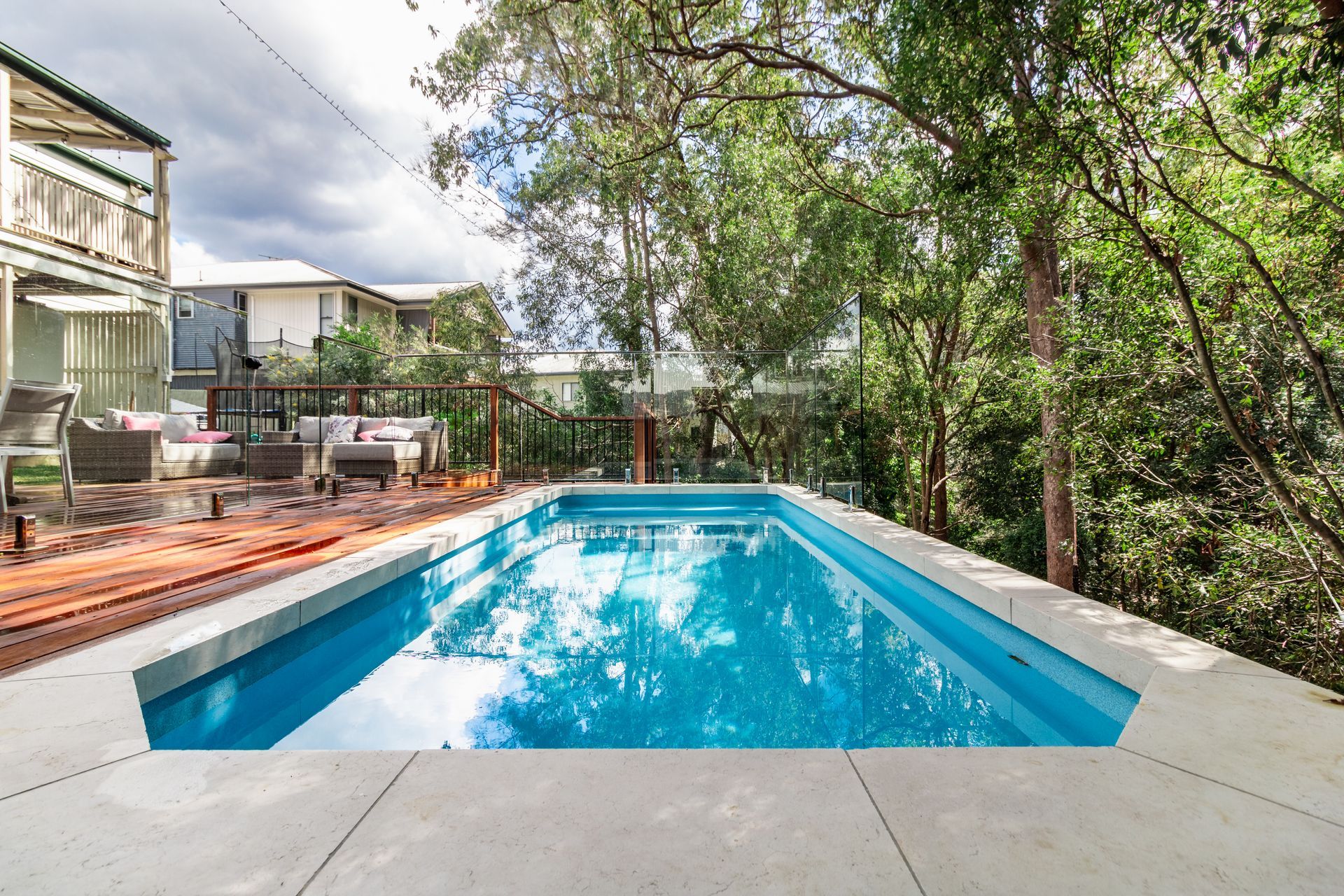 Tricky sites such as this are suited to creating a pool area that seamlessly flows onto an outdoor deck.