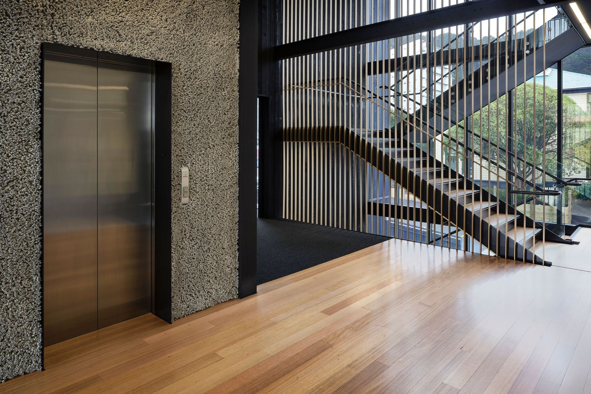 Nick Radford wool rugs applied to the lift frontage at the Royal Society of New Zealand.