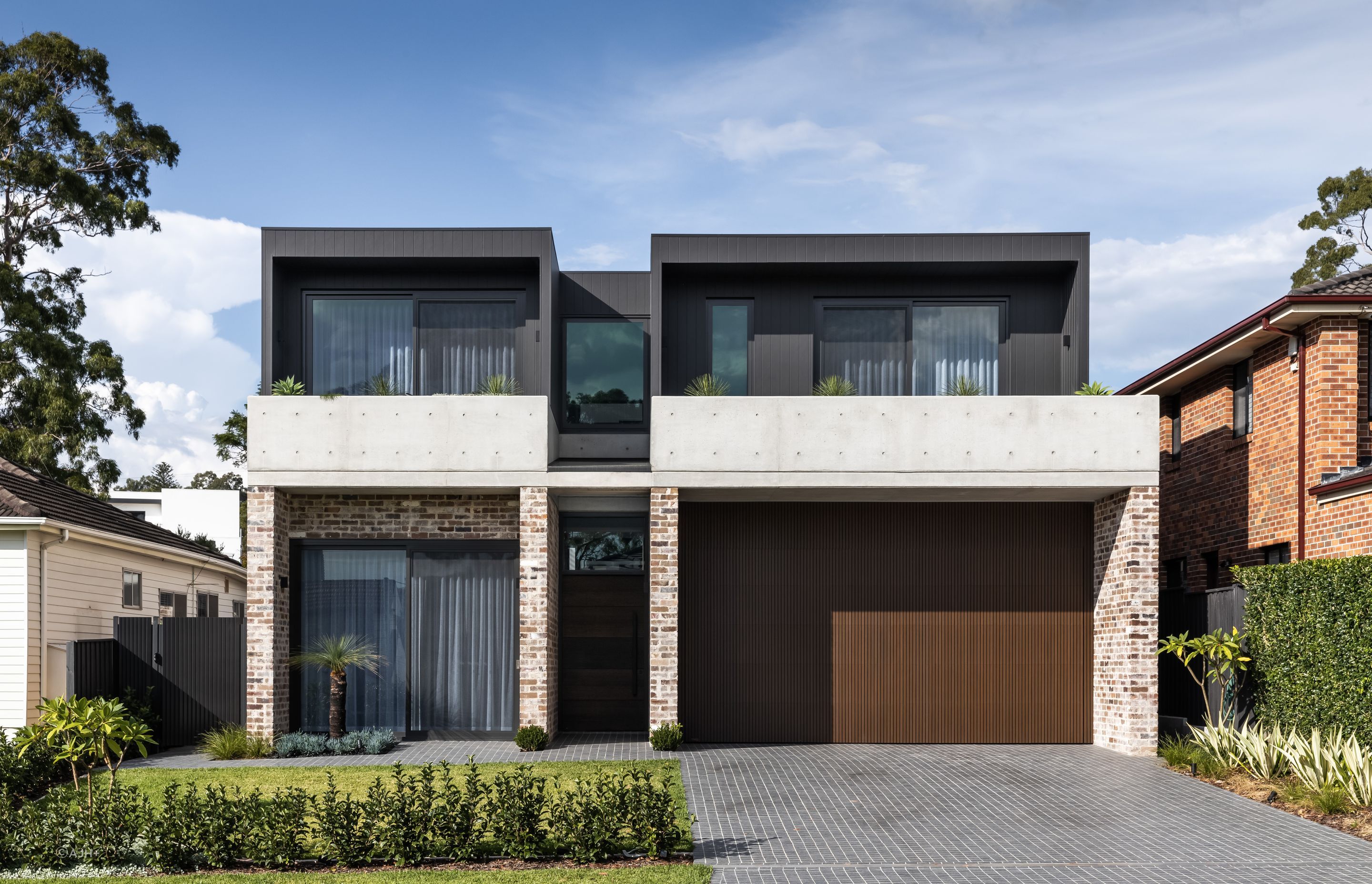Bespoke recycled brick, off-form concrete and dark timber cladding are skillfully balanced in the exterior of Putney House - Photography: Sebastian Photography