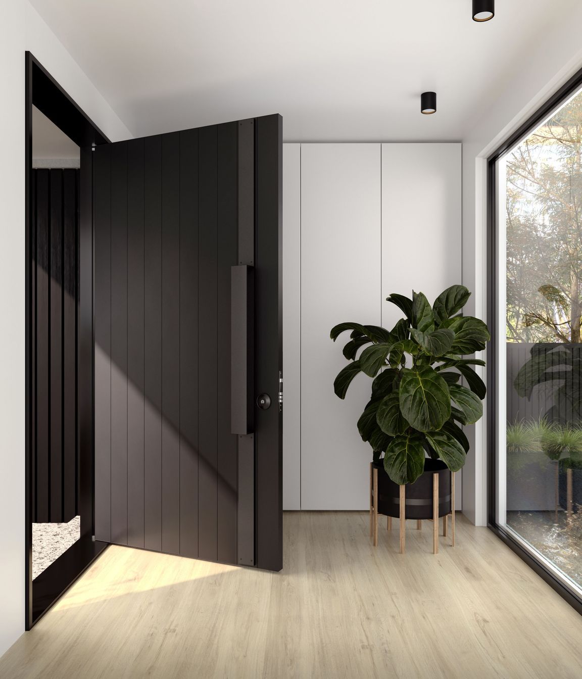 The dark colour of this aluminium door blends seamlessly with the contemporary door hardware.