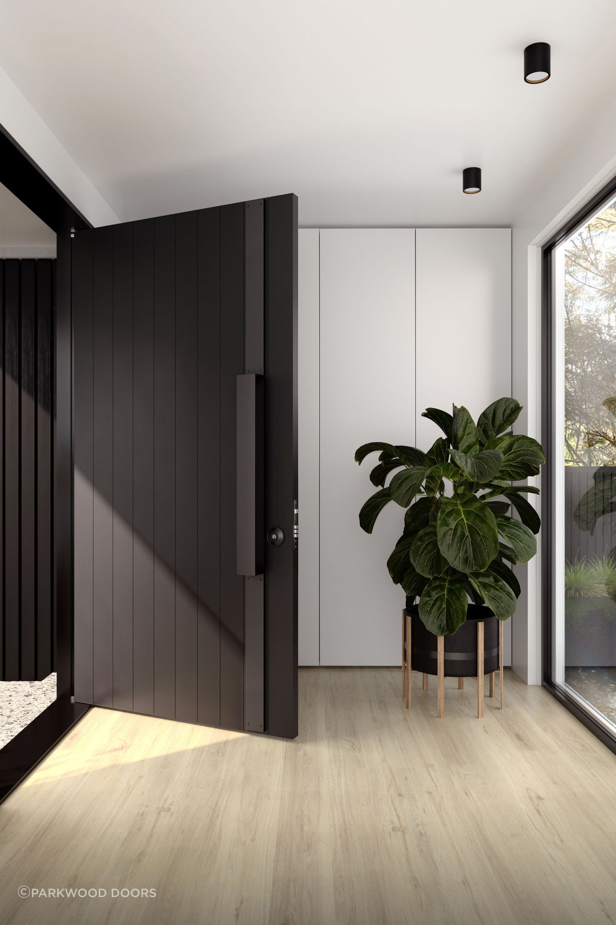 The dark colour of this aluminium door blends seamlessly with the contemporary door hardware.