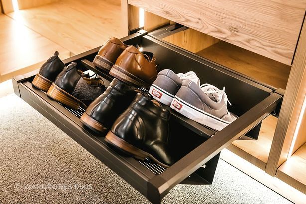Pull-out shoe drawer with metal tilt.
