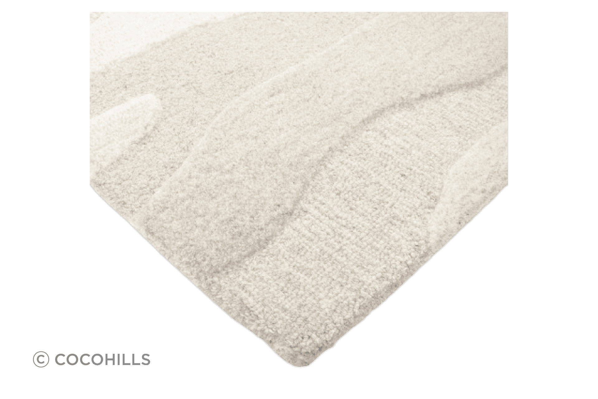 Handtufted from 100% wool, the undulating design of the Shoreline rug is achieved through sections of cut and looped pile, resulting in a captivating visual piece.