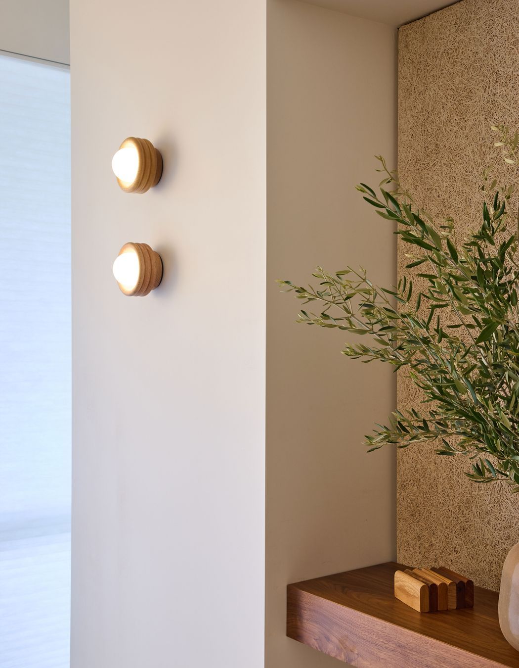 Silo Sconce adding a sculptural warmth with rich tonal depth.