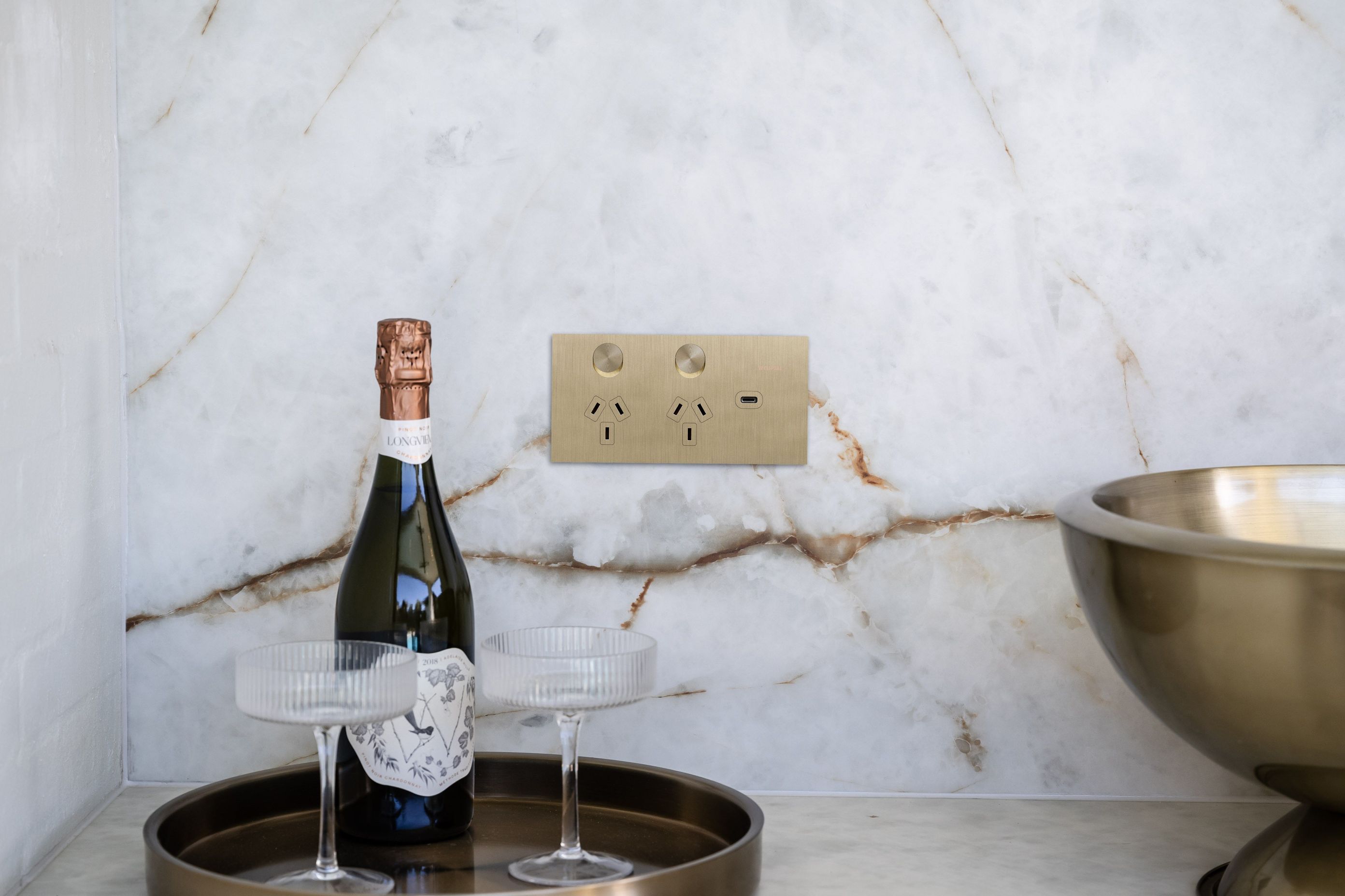 Shown here in brushed brass, the Solis T Series by Clipsal integrates modernist design and satiny texture.