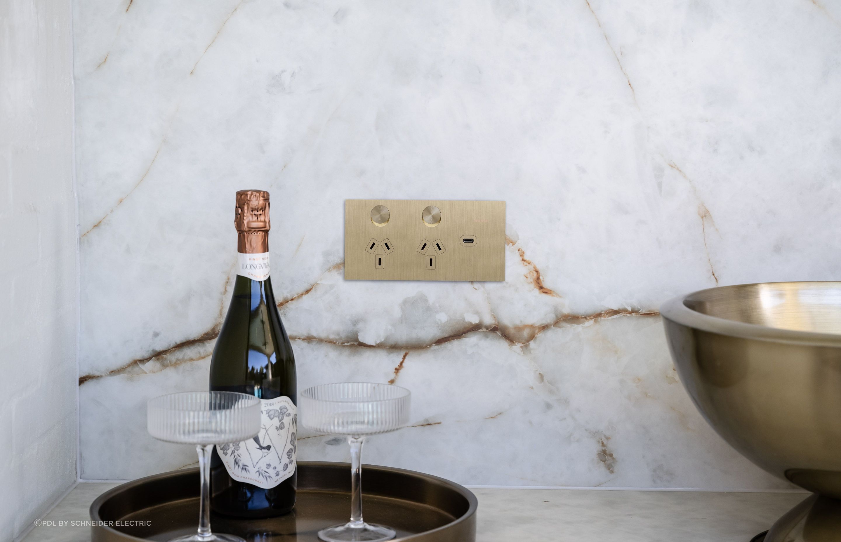 Shown here in brushed brass, the Solis T Series by Clipsal integrates modernist design and satiny texture.