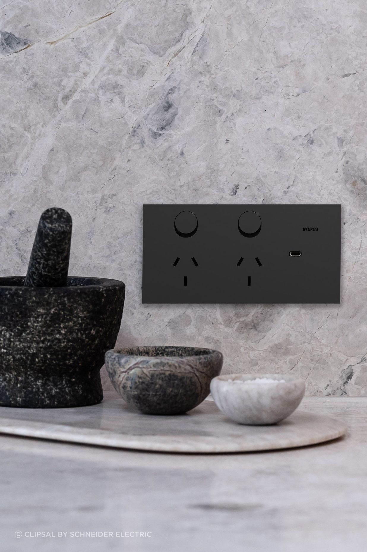 The new Clipsal Solis collection blends minimalism with smart home functionality, setting a luxurious new benchmark in electrical design. Image: Clipsal Solis Double Switch Power Point in Matte Black.