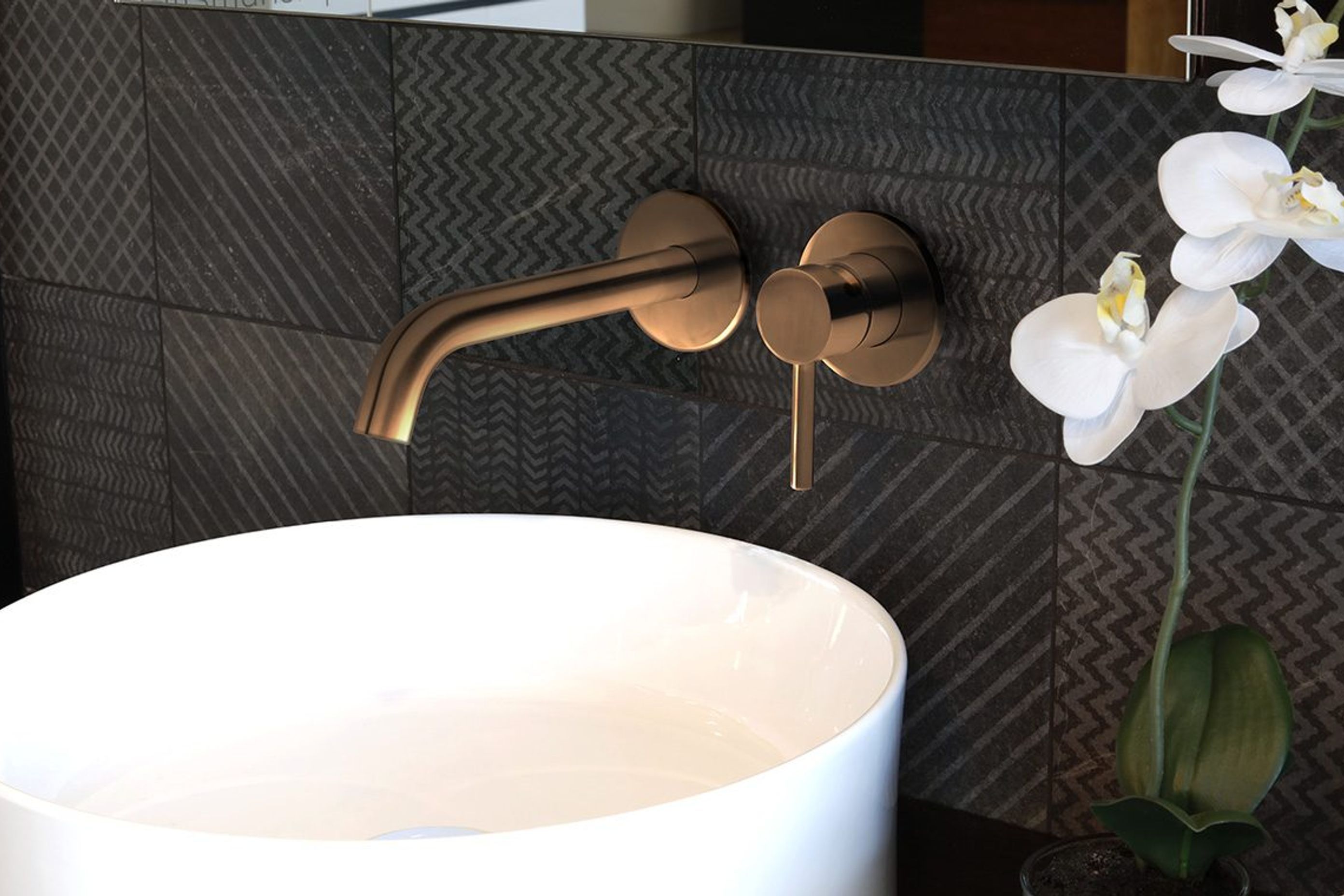 Storm wall mounted basin mixer.