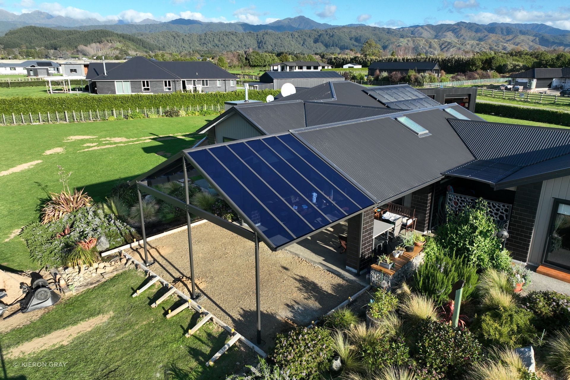 "The polycarbonate roofing provides excellent UV protection and shields from wind, rain, hail, and snow — which was important for this Ashburton property located in a snow zone... Dulux’s Protexture range is ideal for the metal frame as it is scratch-resistant and doesn’t show fingerprints, which helps to keep the canopy looking good as new."