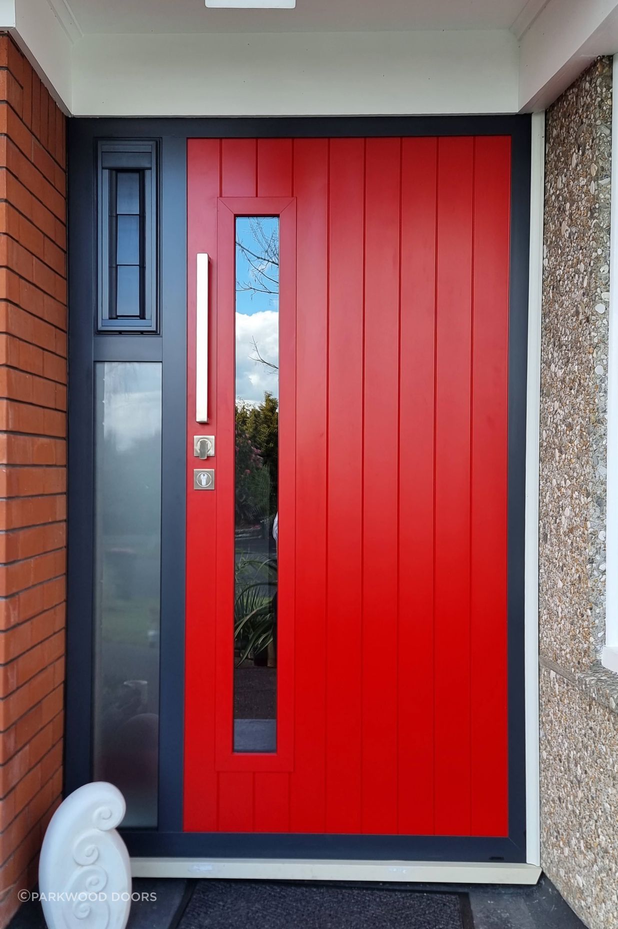 Bright and playful. this composite door features a glass window and vertical grooves.