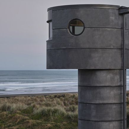 Reflections of Aotearoa: PeterFell's darkest concrete oxide finds its match on North Piha Beach