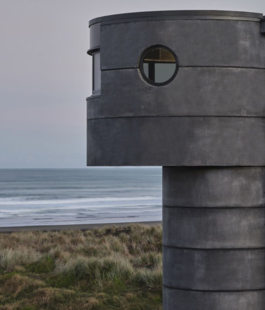 Reflections of Aotearoa: PeterFell's darkest concrete oxide finds its match on North Piha Beach