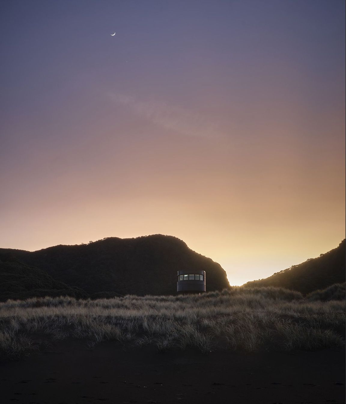 Te Pae at sunrise, peeking gently over the sand dunes.