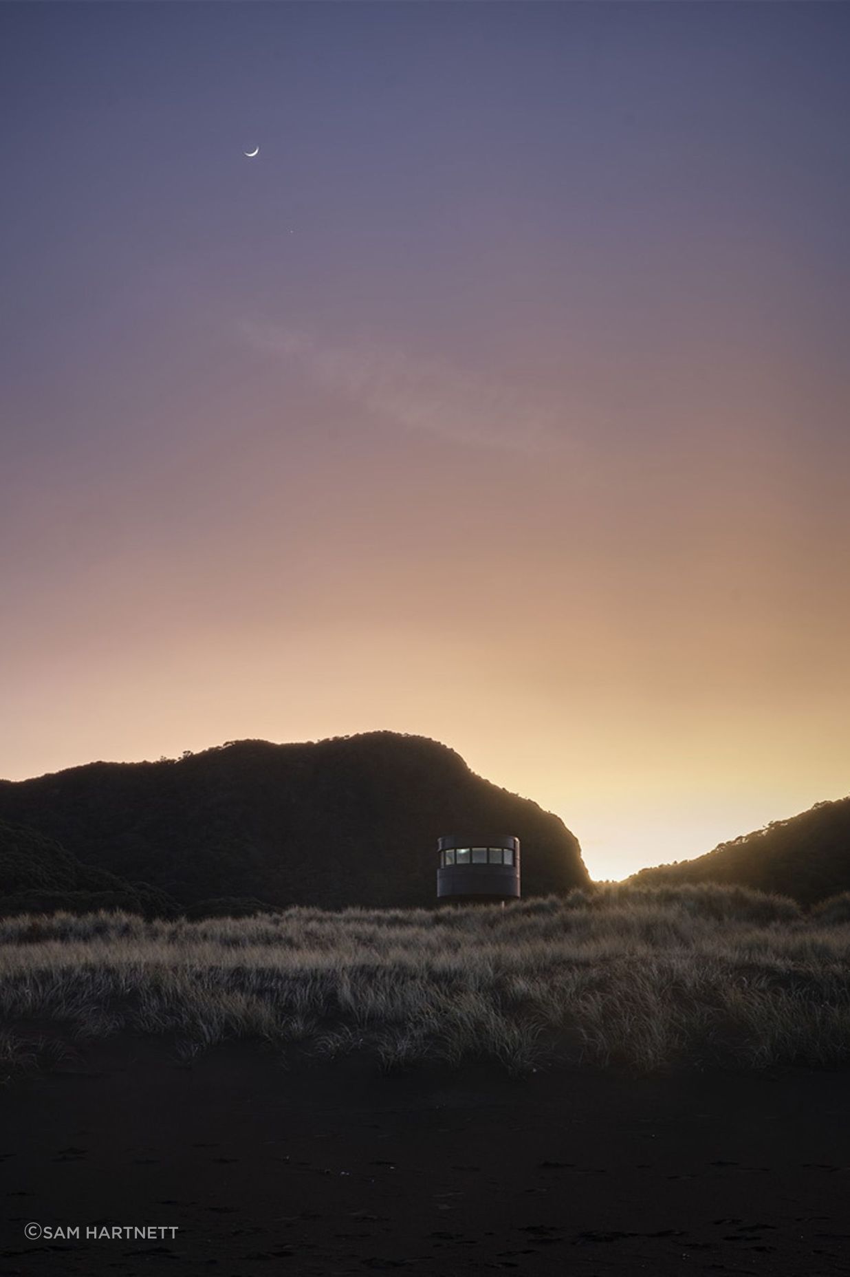 Te Pae at sunrise, peeking gently over the sand dunes.