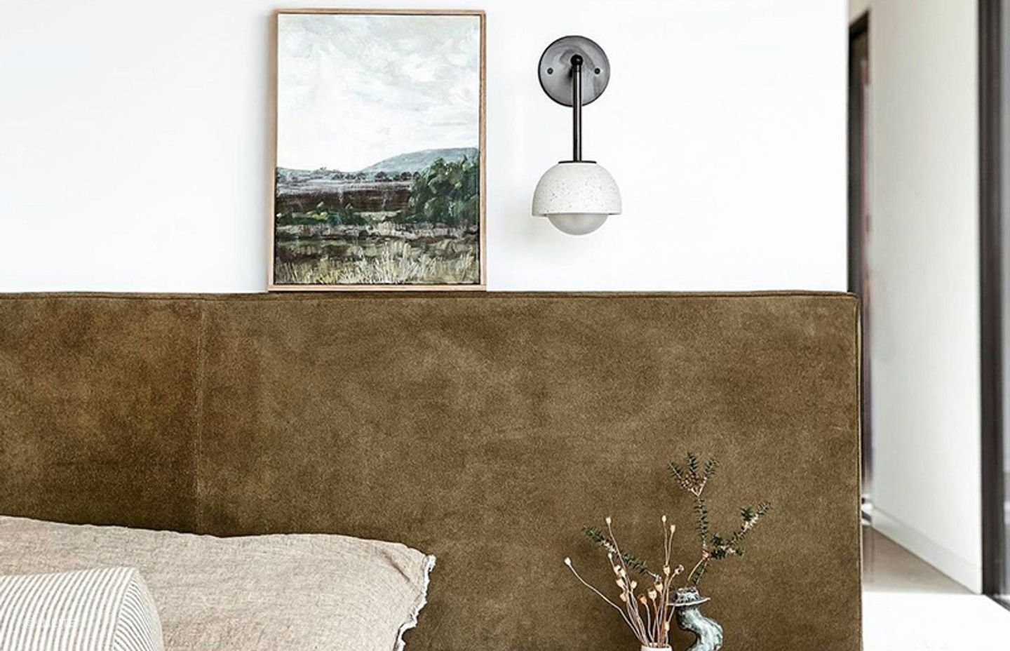 Options like the Terra 0 Long Articulating Wall Light show how wall lighting can work with art and ornamental pieces
