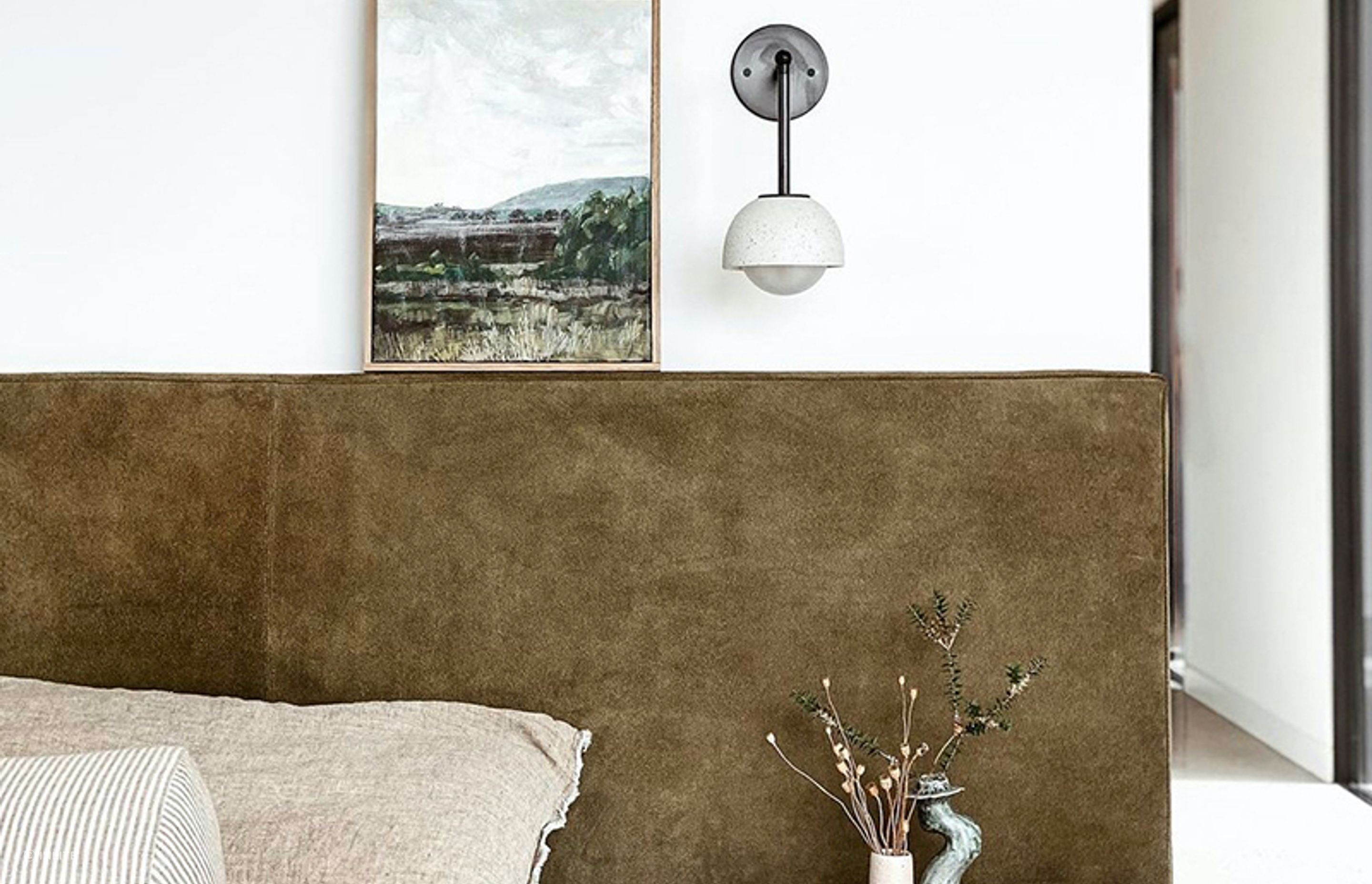 Options like the Terra 0 Long Articulating Wall Light show how wall lighting can work with art and ornamental pieces