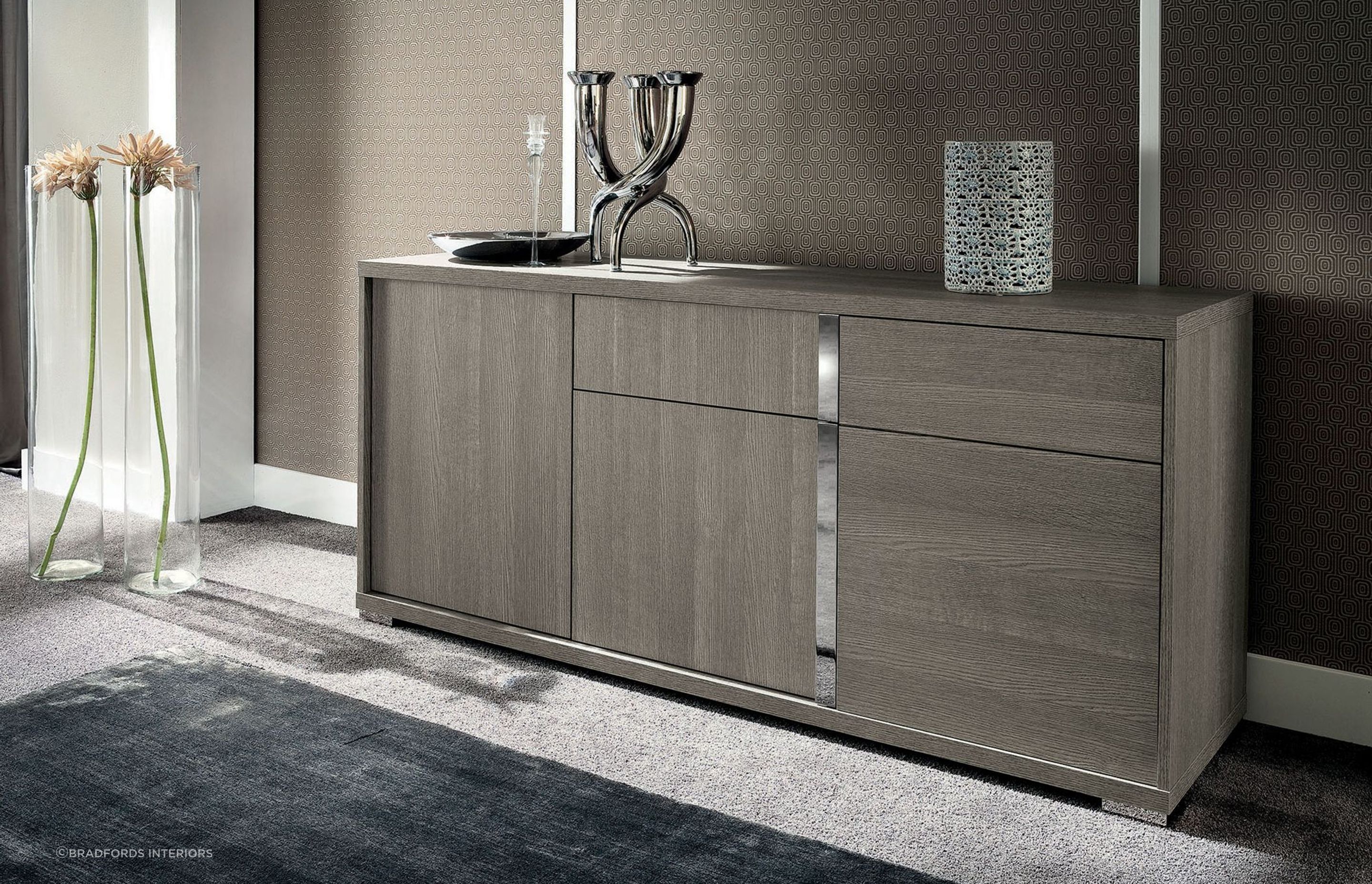 Crisp lines and chrome accents effortlessly elevate the aesthetics of the Tivoli Buffet by Alf Italia