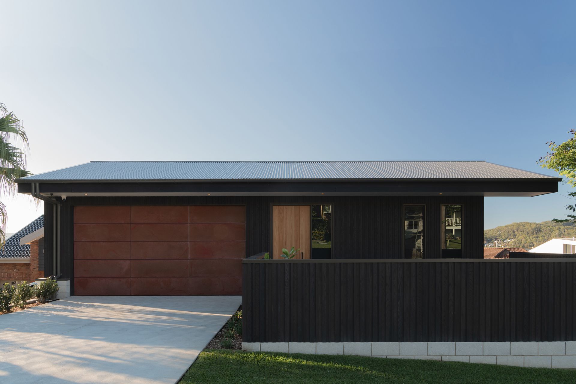 Millboard's Envello cladding in Burnt Cedar.