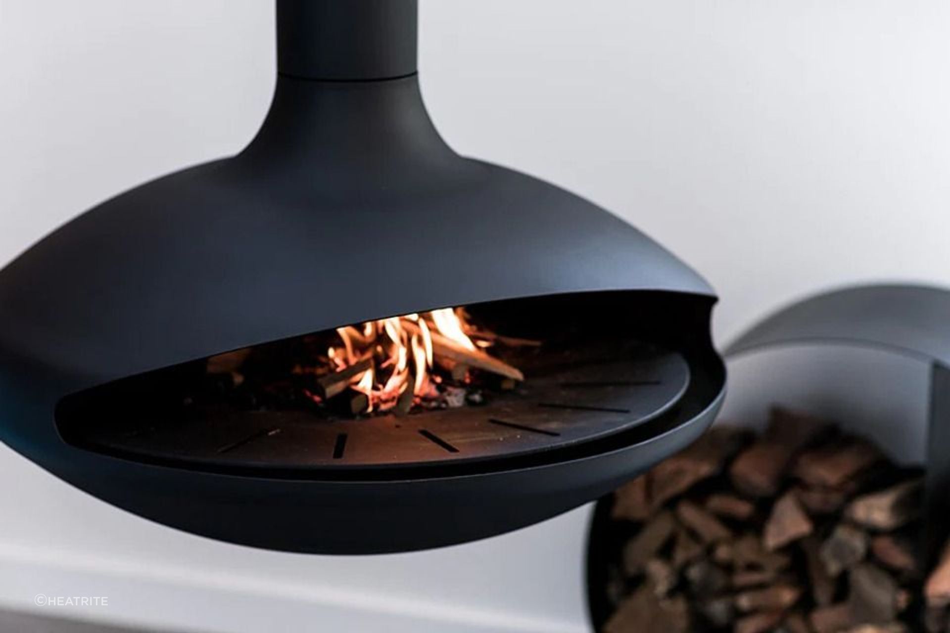 The 'Aether' suspended fireplace doubles up as an indoor pizza oven