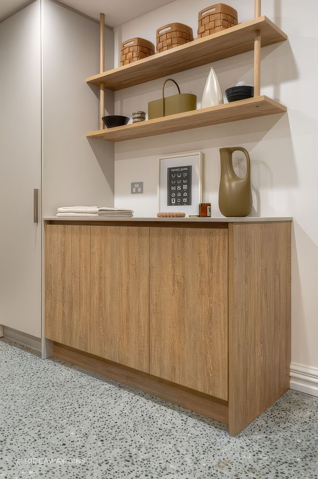 basement-laundry-with-integrated-laundry-hampers-hidden-1-upscaled-by-Replicate.jpg