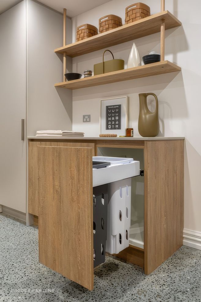 basement-laundry-with-integrated-laundry-hampers-in-view-upscaled-by-Replicate.jpg