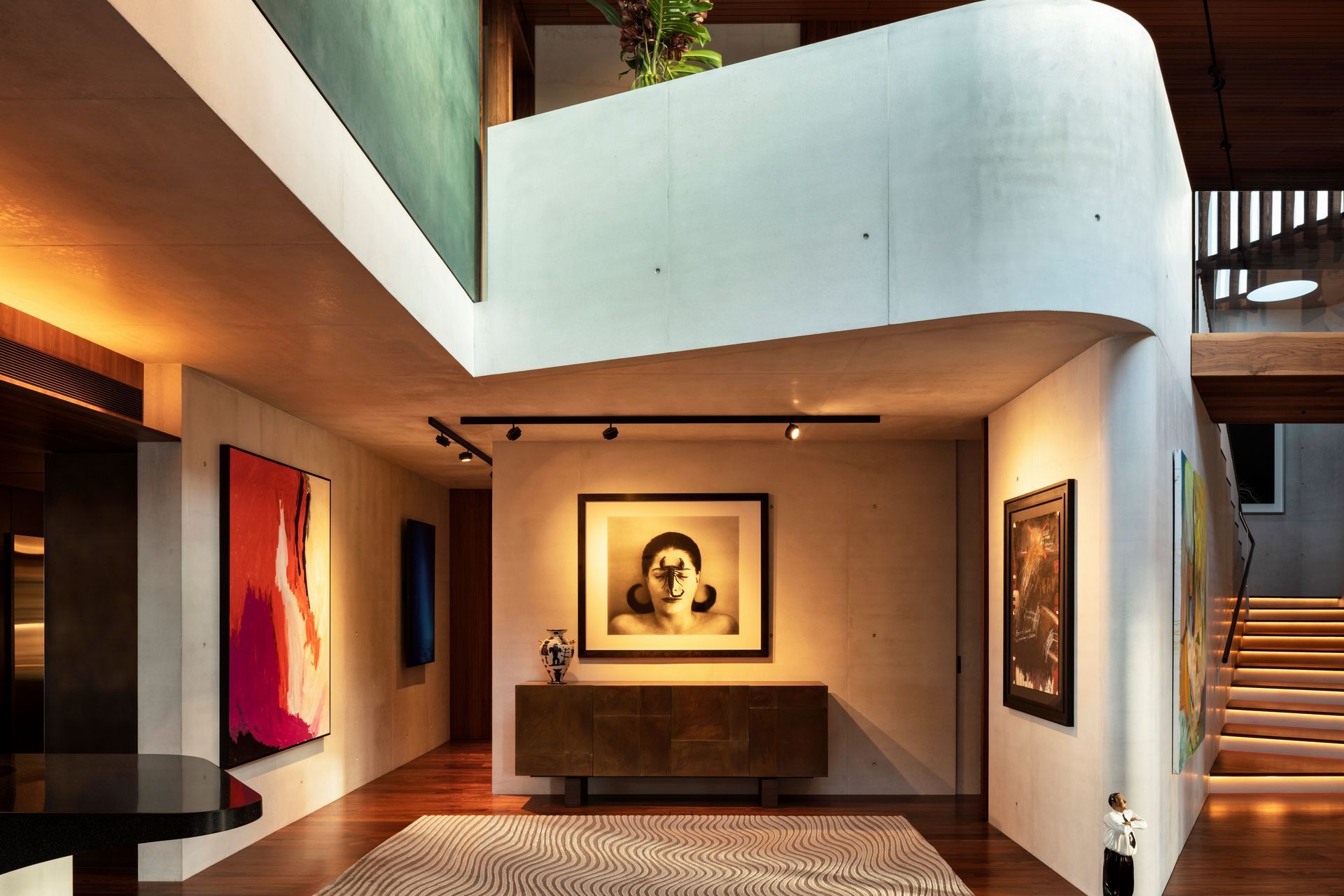 The textured white concrete walls were the perfect backdrop for the client's impressive art collection.