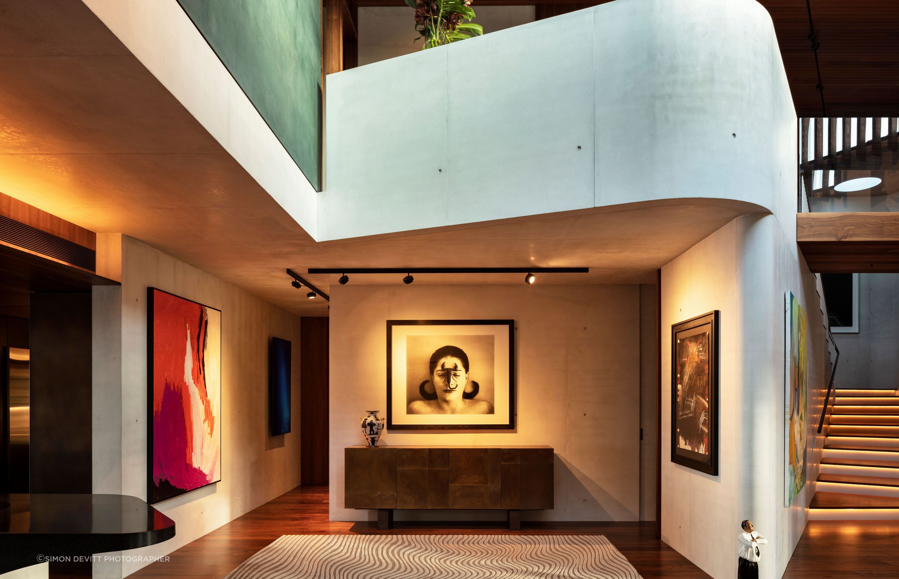 The textured white concrete walls were the perfect backdrop for the client's impressive art collection.