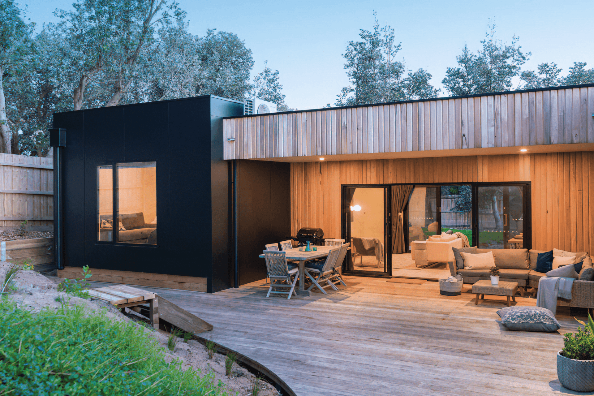 A curved deck, showcasing natural materials gives an elegant warmth and elevates a feeling of design as shown in this Cape Woolamai development.