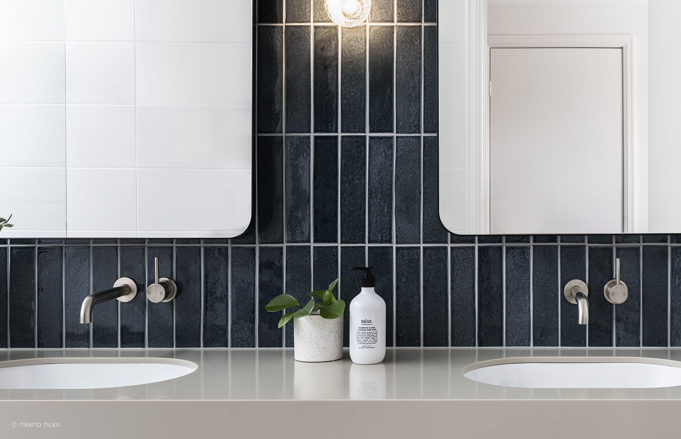 An elegant use of Motto Dark Blue Subway Tiles, vertically orientated for style