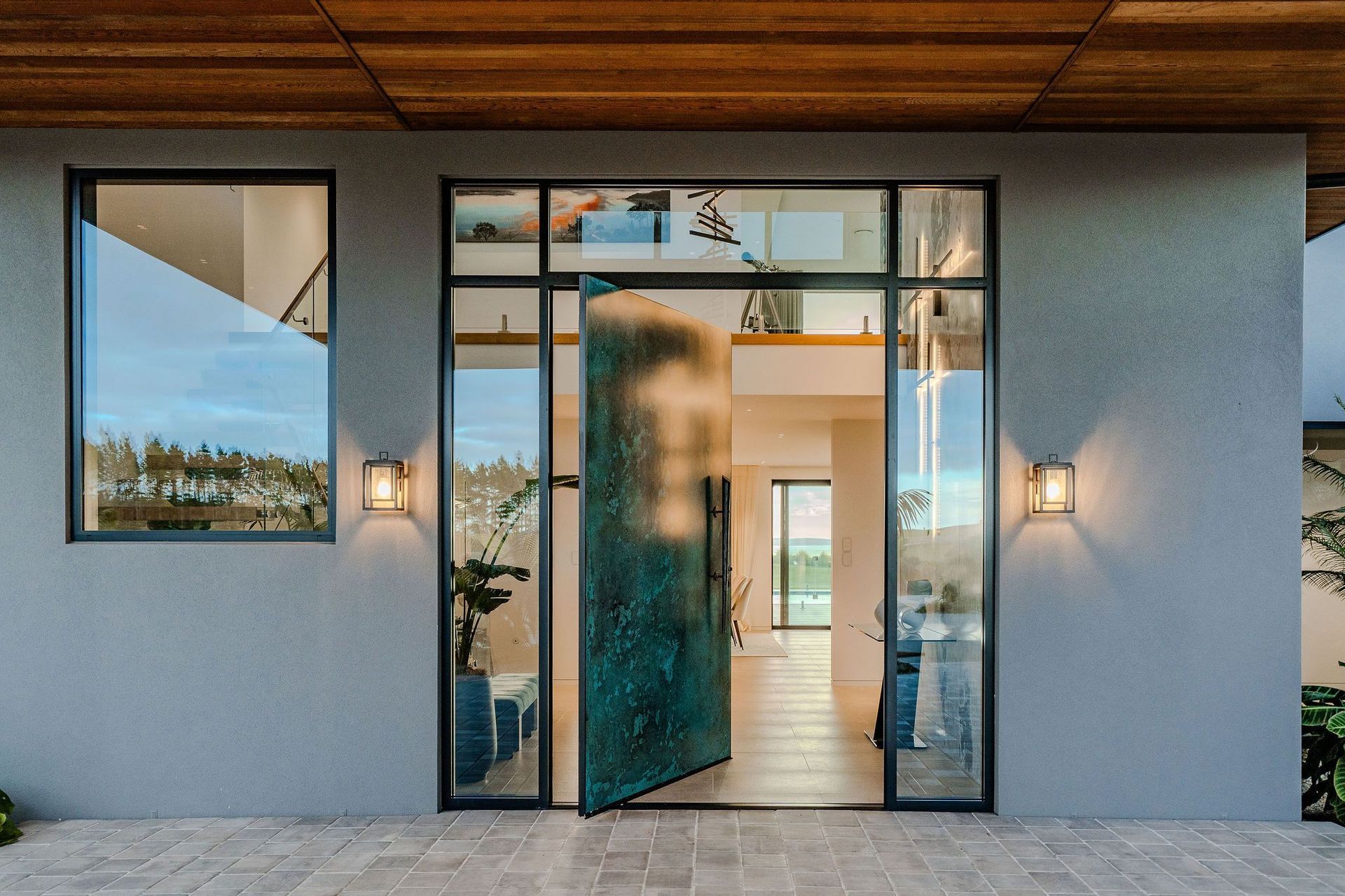 This Karikari Peninsula Residence uses Ezpanel 50mm AAC Concrete Panel Cladding by Specialized Construction Products to achieve a clean concrete facade.