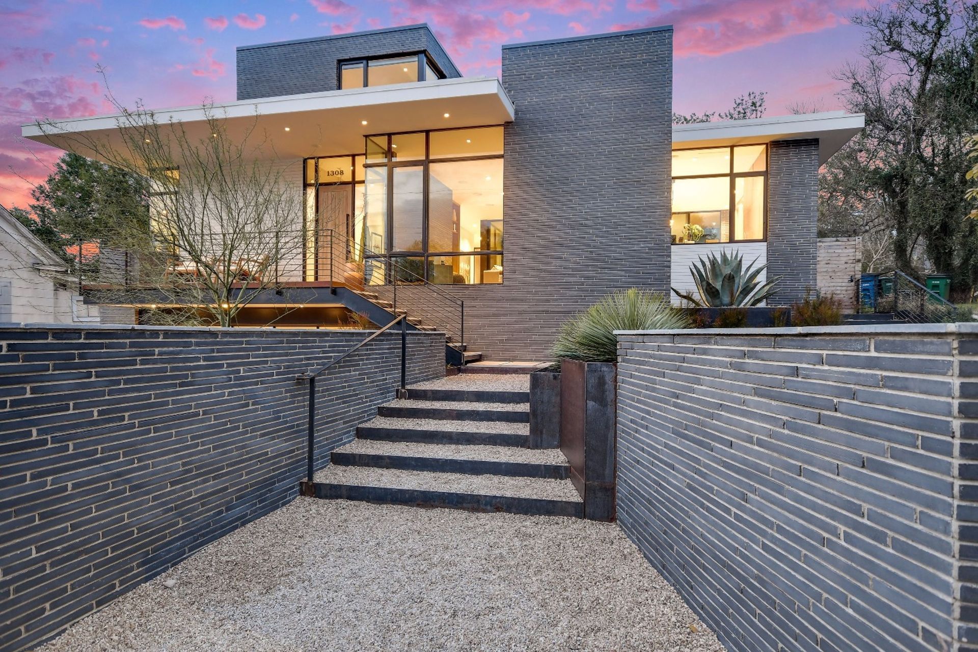 Dramatic proportions inherent in long-format bricks accentuate the linear feel of this walled entrance.