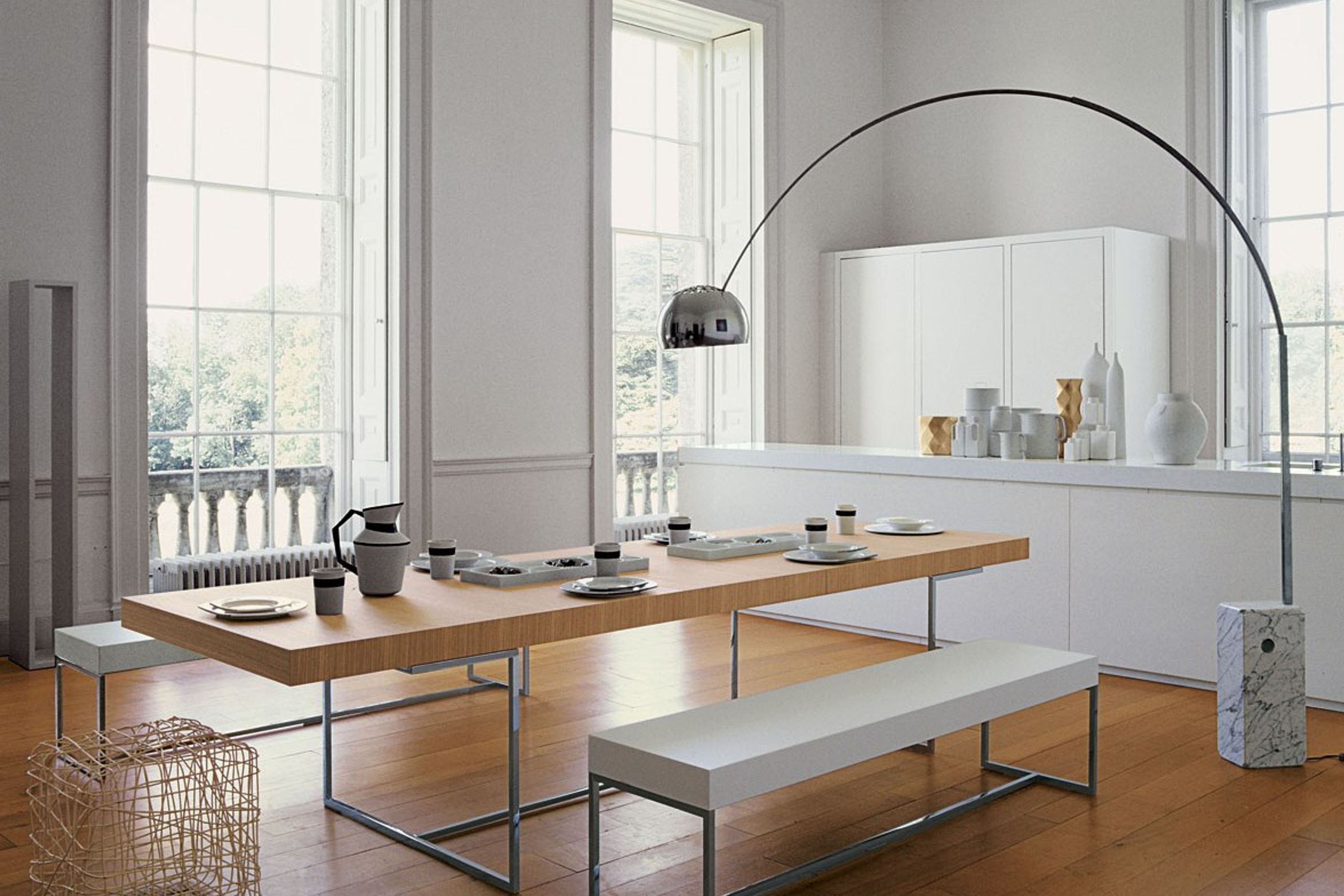 Designer products like the Arco Floor Lamp by Flos are an artistic and functional addition to a space.