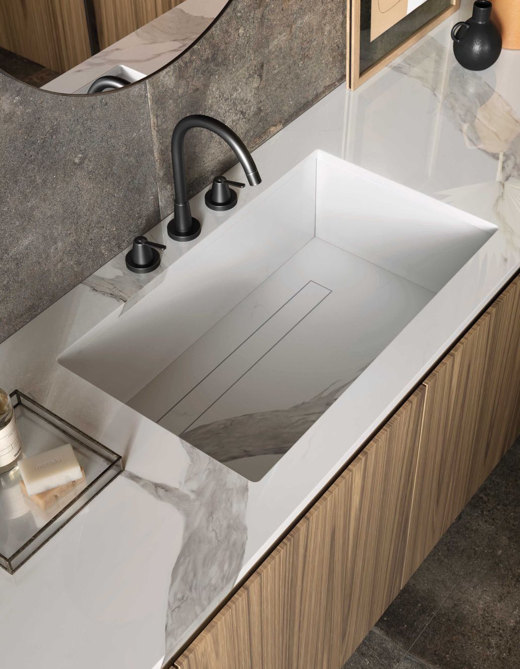 Porcelain slabs perform well in a bathroom environment and can be used for vanity tops, washbasins and shower trays.