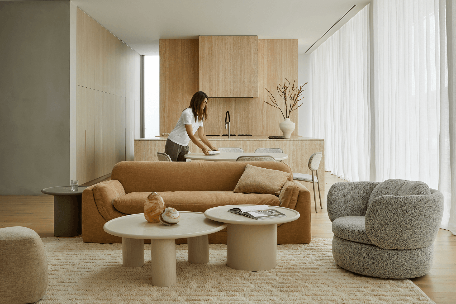 Curves and sculptural interest are celebrated in the new collection, paired with a warm and earthy palette.