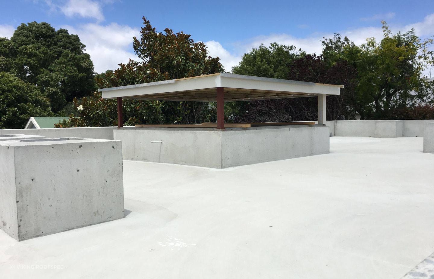 Layers are added meticulously, starting with the waterproofing membrane.